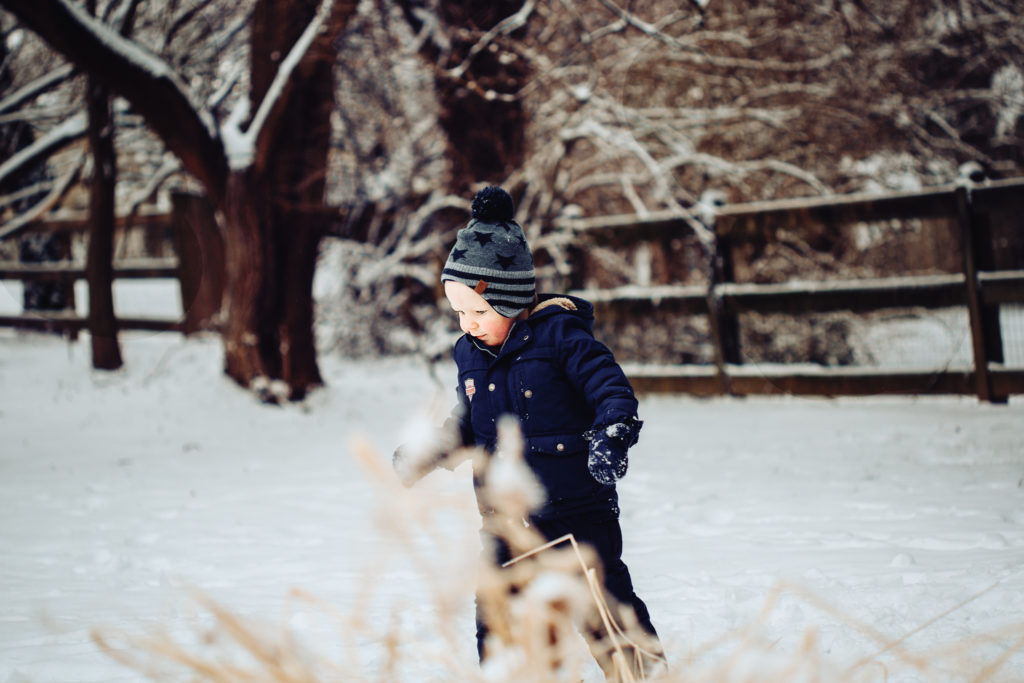 baby walking in the snow